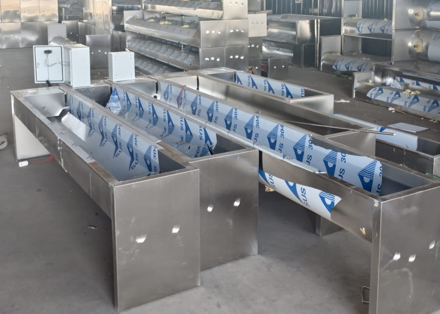 a long water trough for a large herd of cows