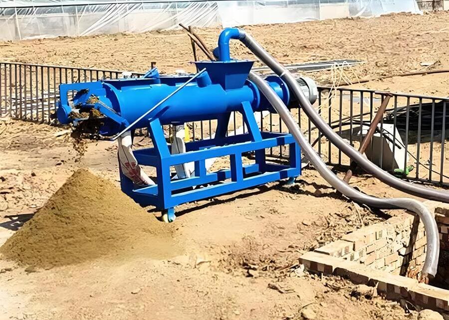 A screw press manure separator in action on a dairy farm