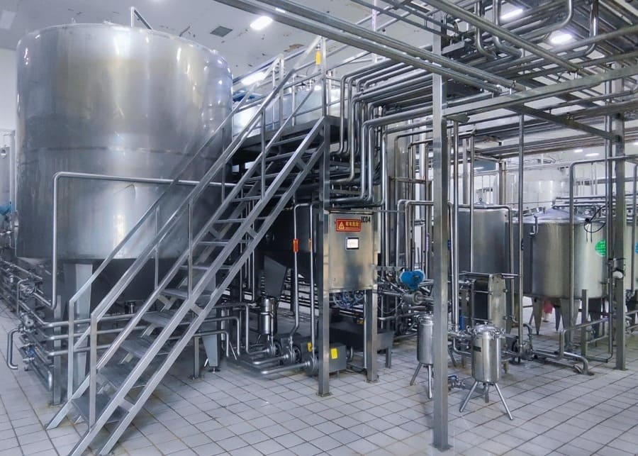 Complete Dairy Processing Equipment Line A complete dairy processing line with stainless steel tanks and pipes