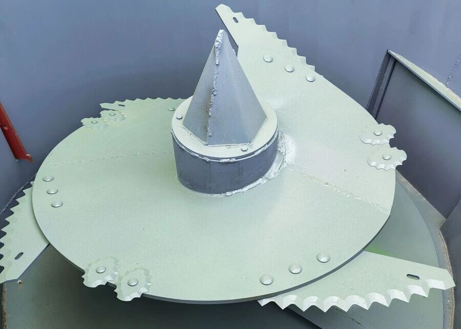 a vertical TMR mixer with augers visible