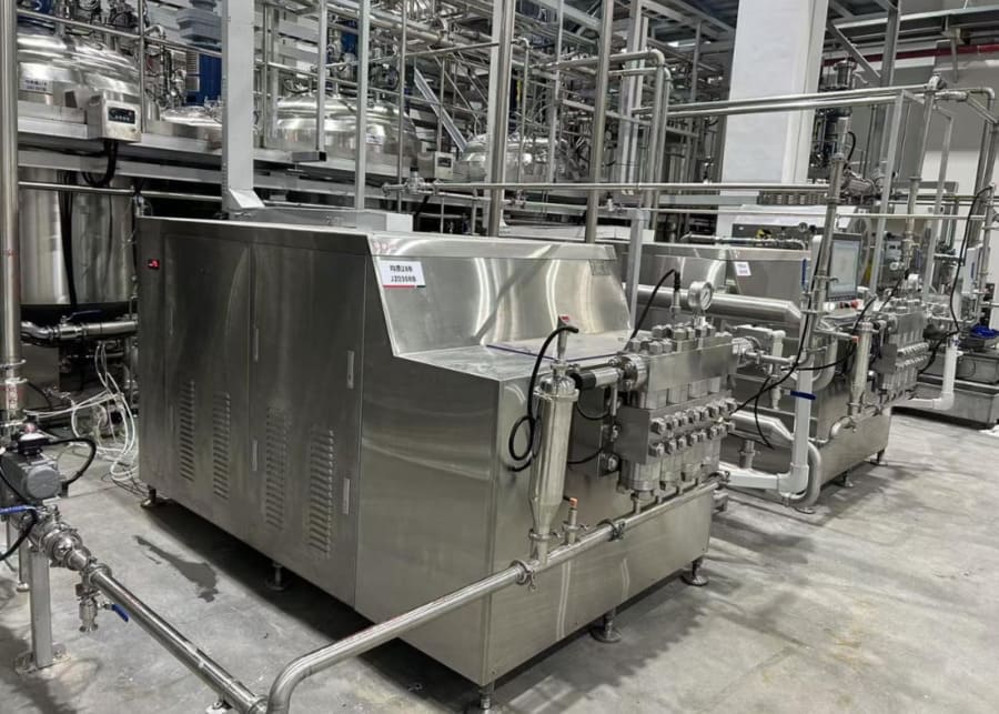 Industrial high-pressure homogenizers integrated into a complete NexAgri dairy processing line for optimal milk pressure control