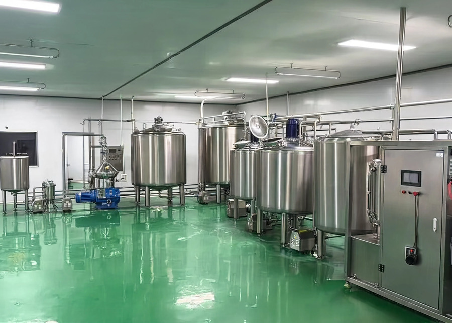 A clean, modern yogurt processing facility with stainless steel equipment.
