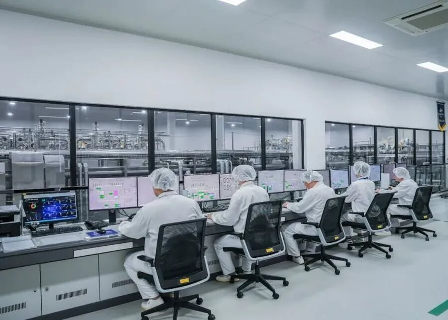 Industrial dairy processing control room monitoring automated yogurt production lines and homogenization parameters