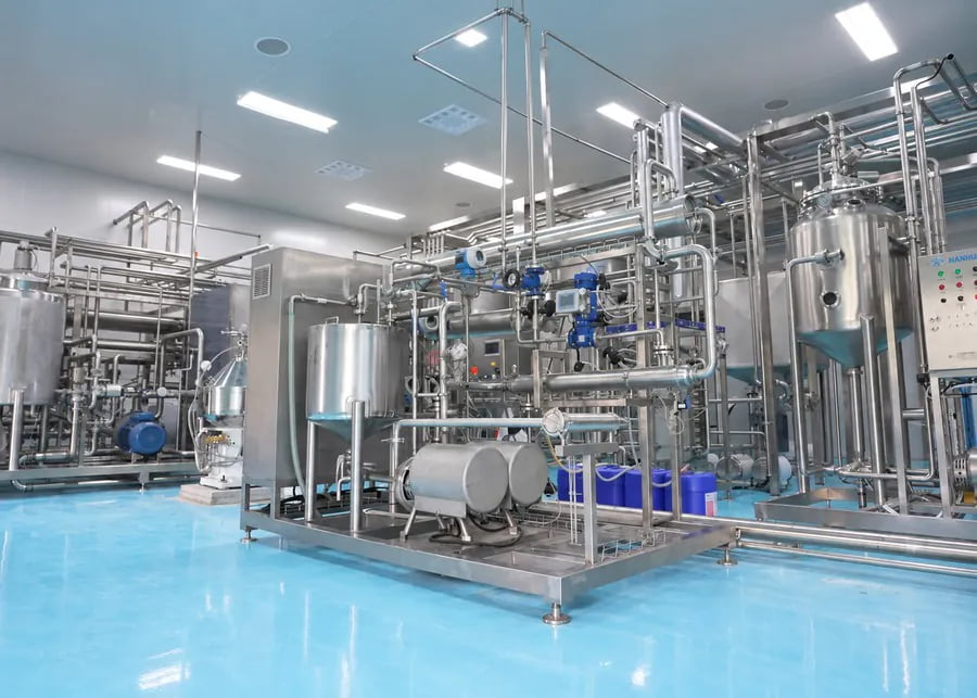 Sanitary commercial dairy processing skid with tubular heat exchanger, CIP cleaning system, and fermentation tanks