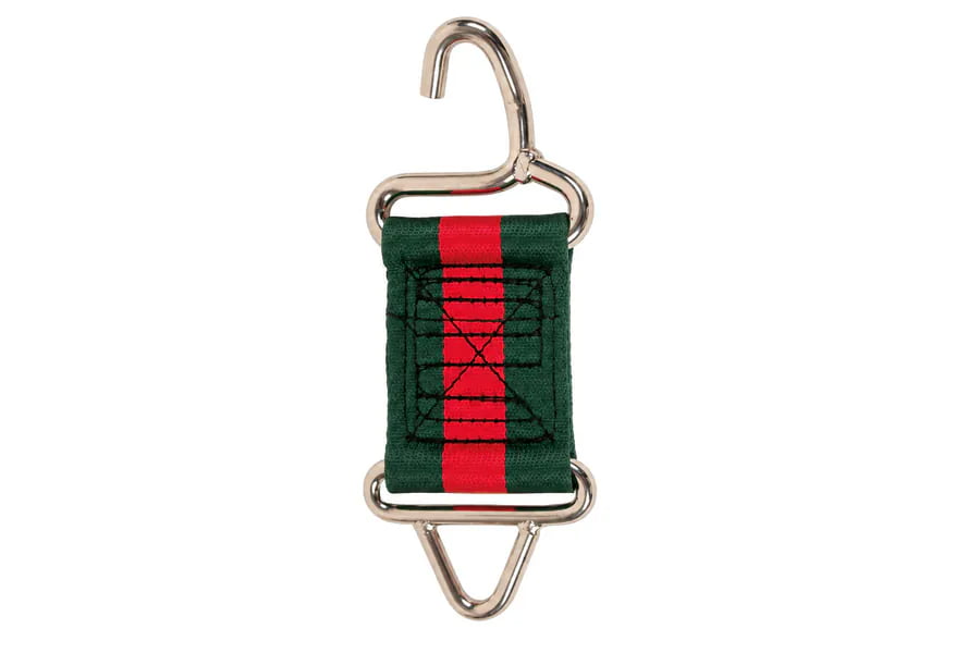 Hoof trimming hook with a green and red restraint strap